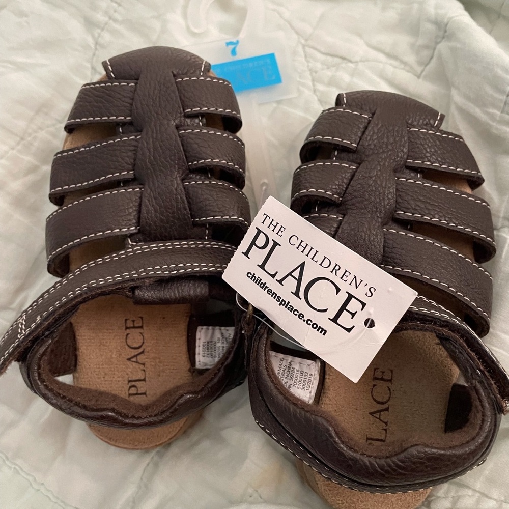 Children place brown shoes